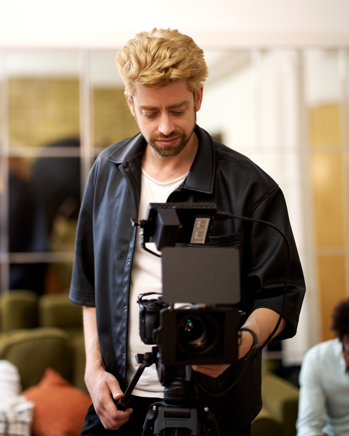 About Morax Studio - B2B Visual Content Solutions Etienne Morax working with a camera as part of Morax Studio